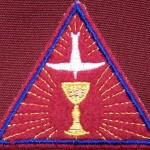 Trinitarian emblem worn over the heart.