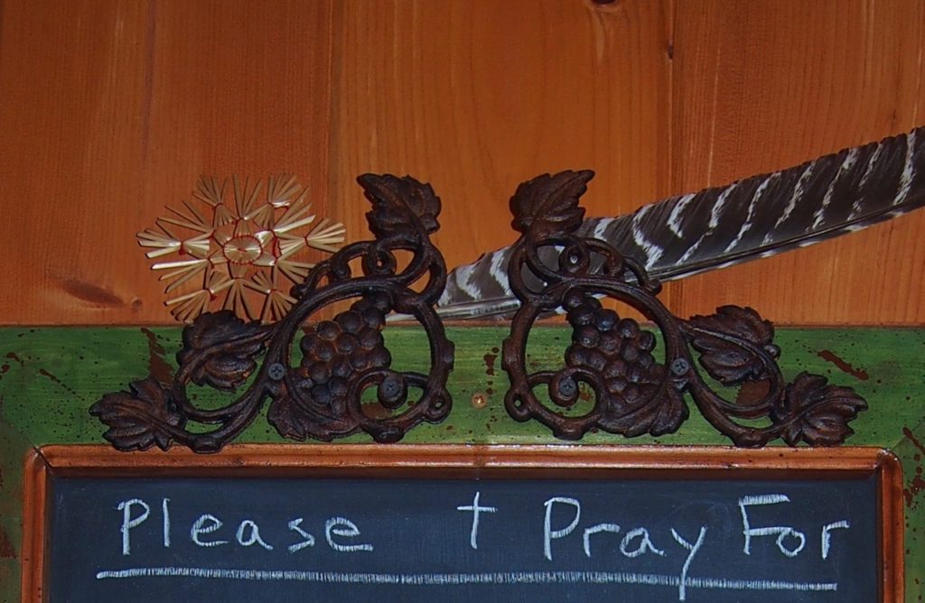 A symbol of the fruit of the vine that becomes the Precious Blood by the priest's words of consecration. On the chalkboard below: names of Priests to pray for!